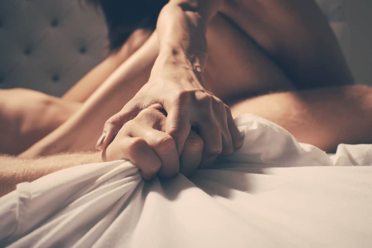 couple holding hand tight